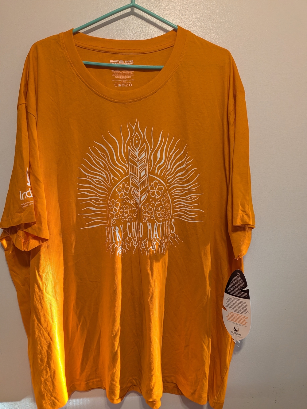 Inspire Bright Orange Short Sleeve Tee with White Sun & Feather Graphic